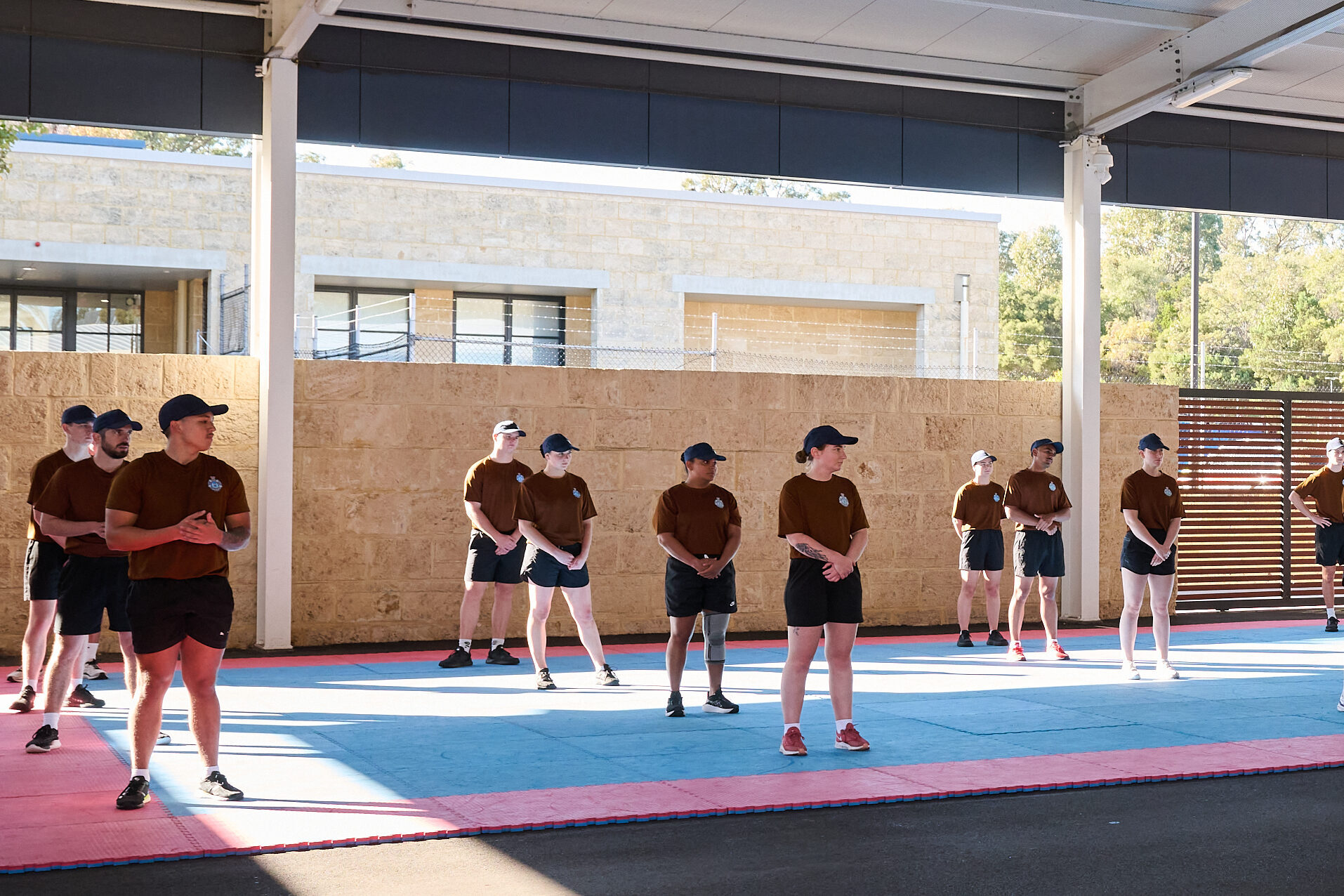 Police recruits lined up for fitness training.